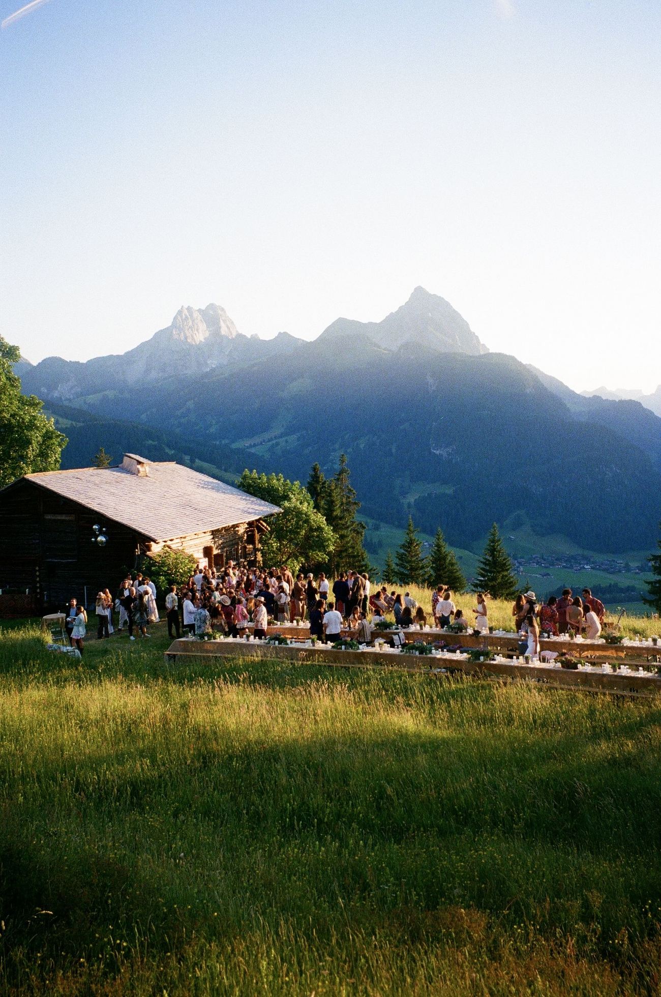 Everyone on the lawn in front of the chalet